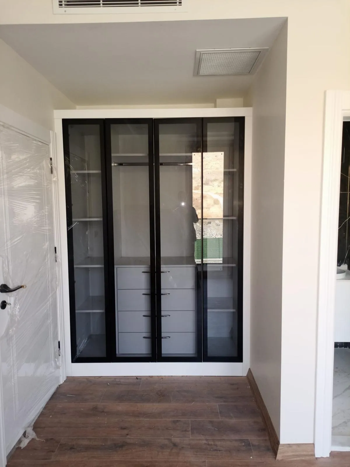Minimalist Glass-Front Custom Closet, Custom Closet Systems project in Sarasota — photo 2 of 2