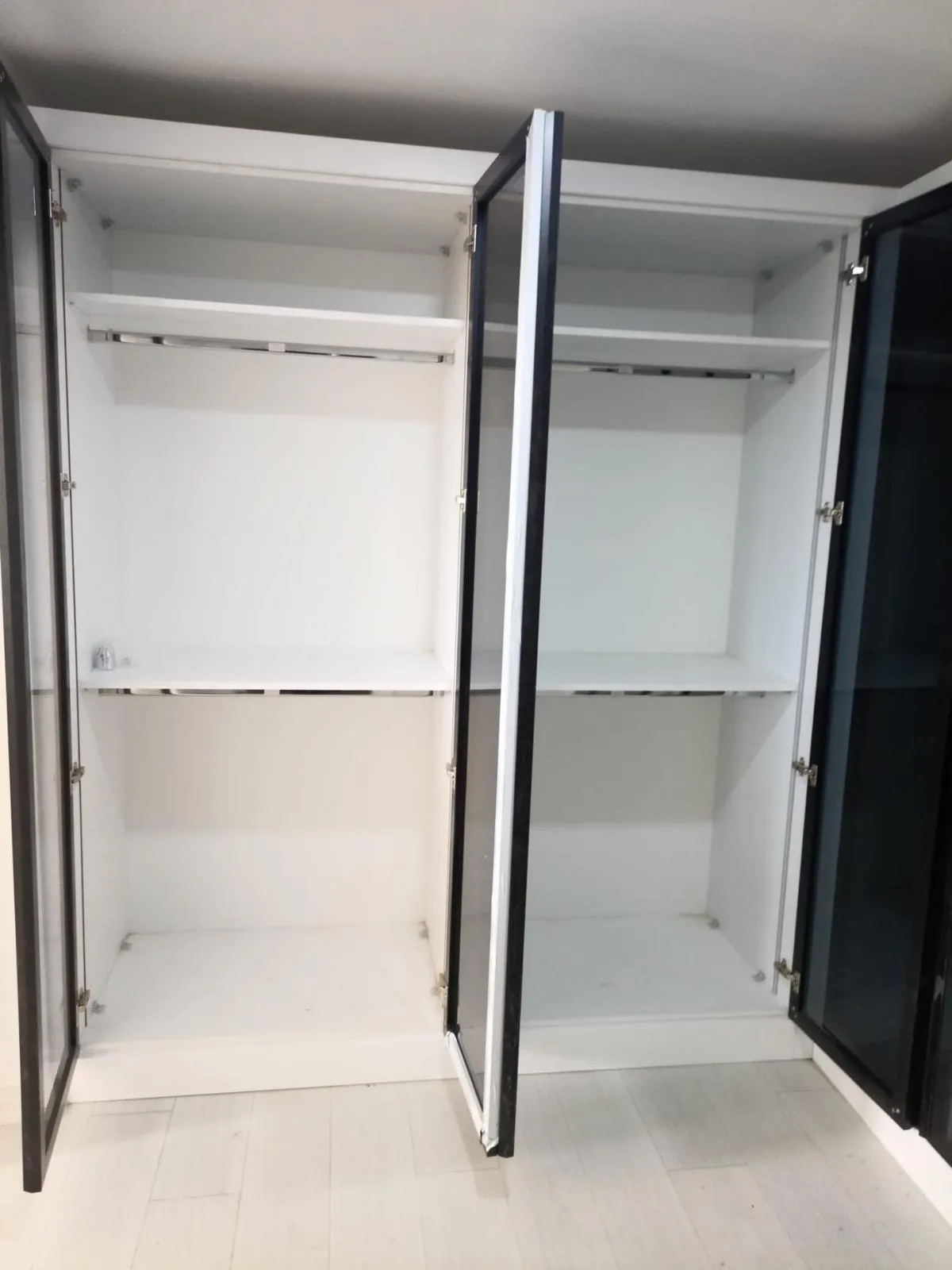 Contemporary Glass-Front Corner Wardrobe, Custom Closet Systems project in Turkey Istanbul — photo 2 of 4
